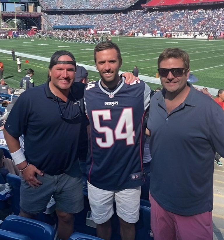 Chris and his friends at a football game
